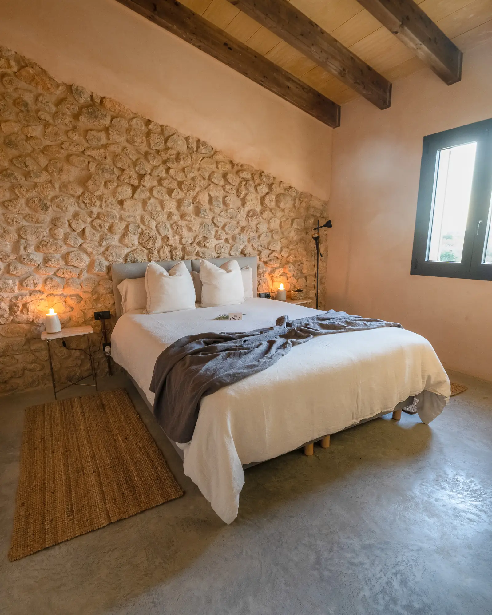 Casa Mana first-floor double bedroom — restful and private, with warm morning light