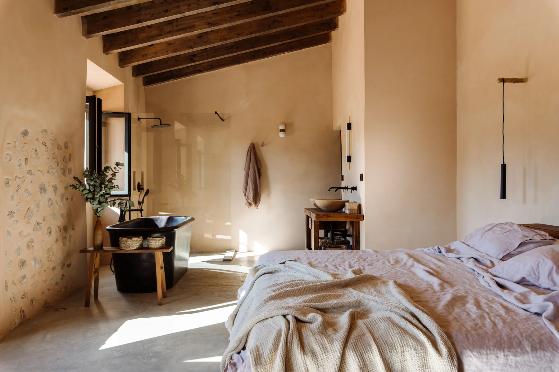 Casa Mana master suite — freestanding wooden bath, soft linens and garden views