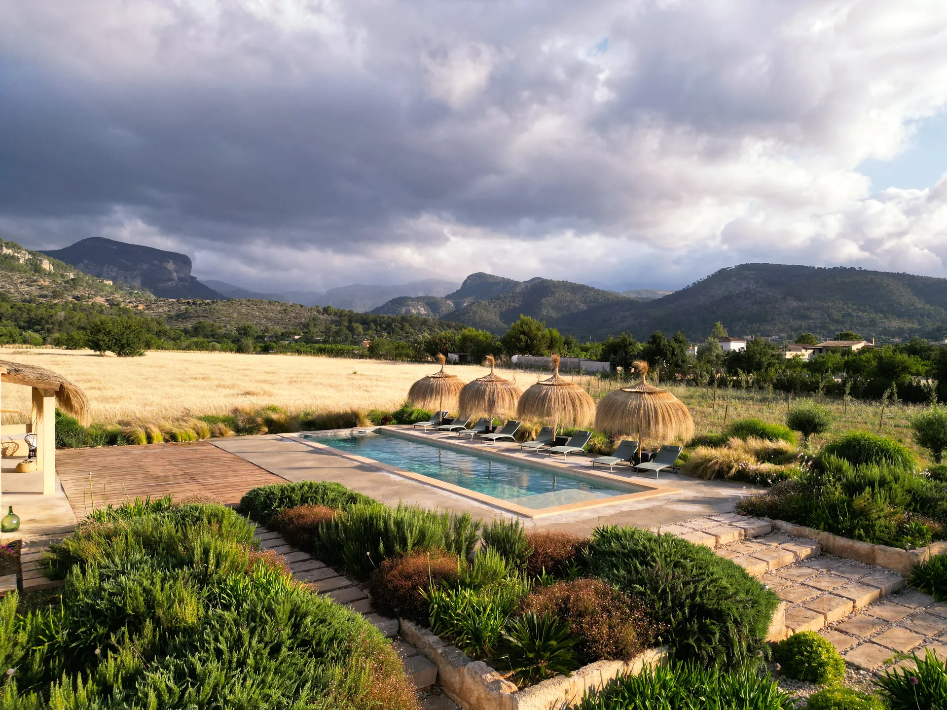 The pool and garden under dramatic Mallorcan skies — a different light