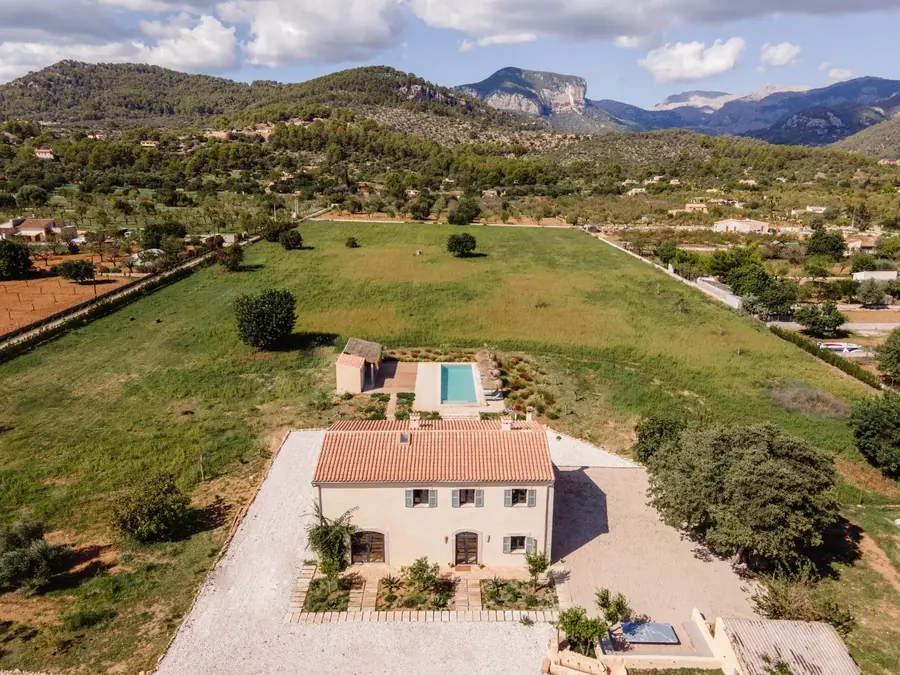 Aerial view of Casa Mana — the house, pool and surrounding landscape