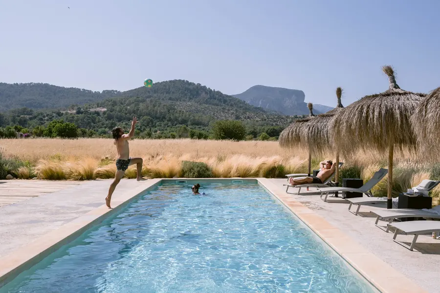 A running jump into the pool — summer days at Casa Mana